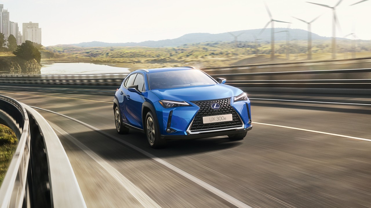 A Lexus UX 300e driving on a road